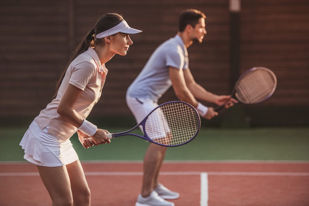 A couple playing tennis